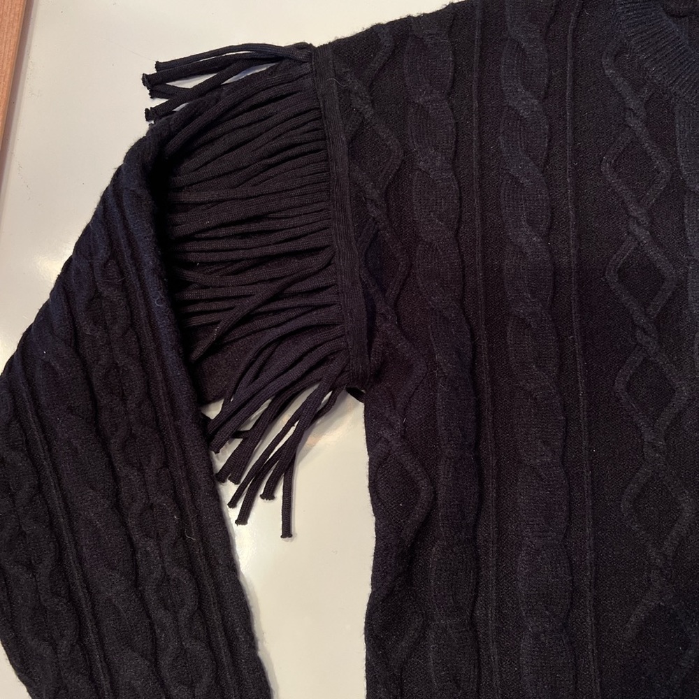 Brand new, never worn! Soft Black Sweater with Fringe on Shoulders.